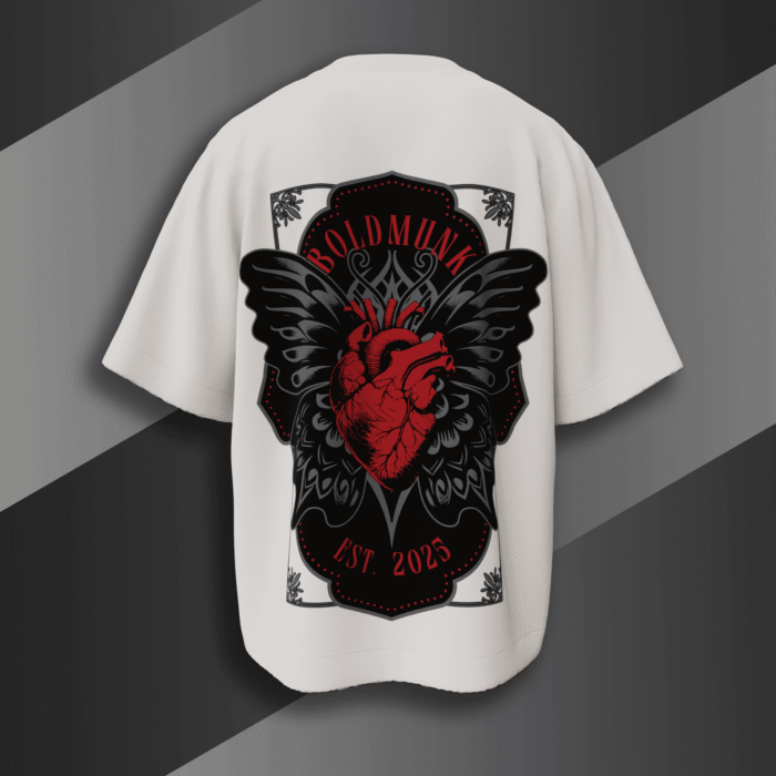 alt="White oversized t-shirt with bold red anatomical heart and black gothic wings graphic, BoldMunk EST. 2025 design on the back"