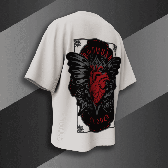 alt="White oversized t-shirt with bold red anatomical heart and black gothic wings graphic, BoldMunk EST. 2025 design on the back"