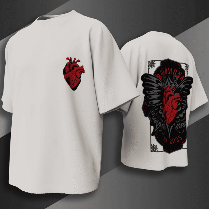 alt="White oversized t-shirt with bold red anatomical heart and black gothic wings graphic, BoldMunk EST. 2025 design on the back"