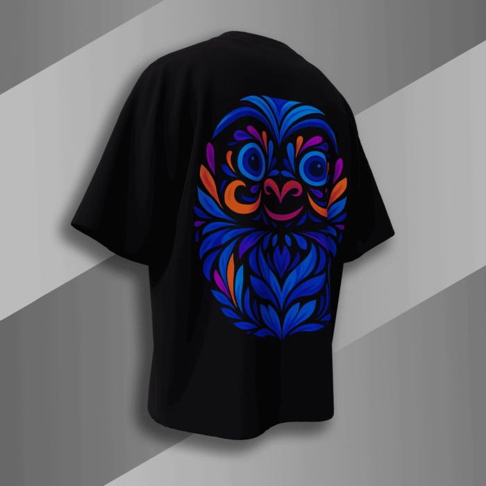 “Black oversized t-shirt with vibrant blue and orange Japanese Daruma doll design on the back, minimal front chest logo, Bold Munk streetwear”